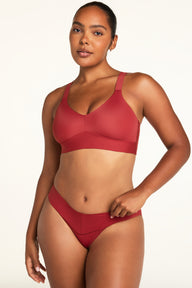Close-up front view of the BlissSmooth Bralette in Ruby paired with the Bliss Low Rise Bikini in Ruby.