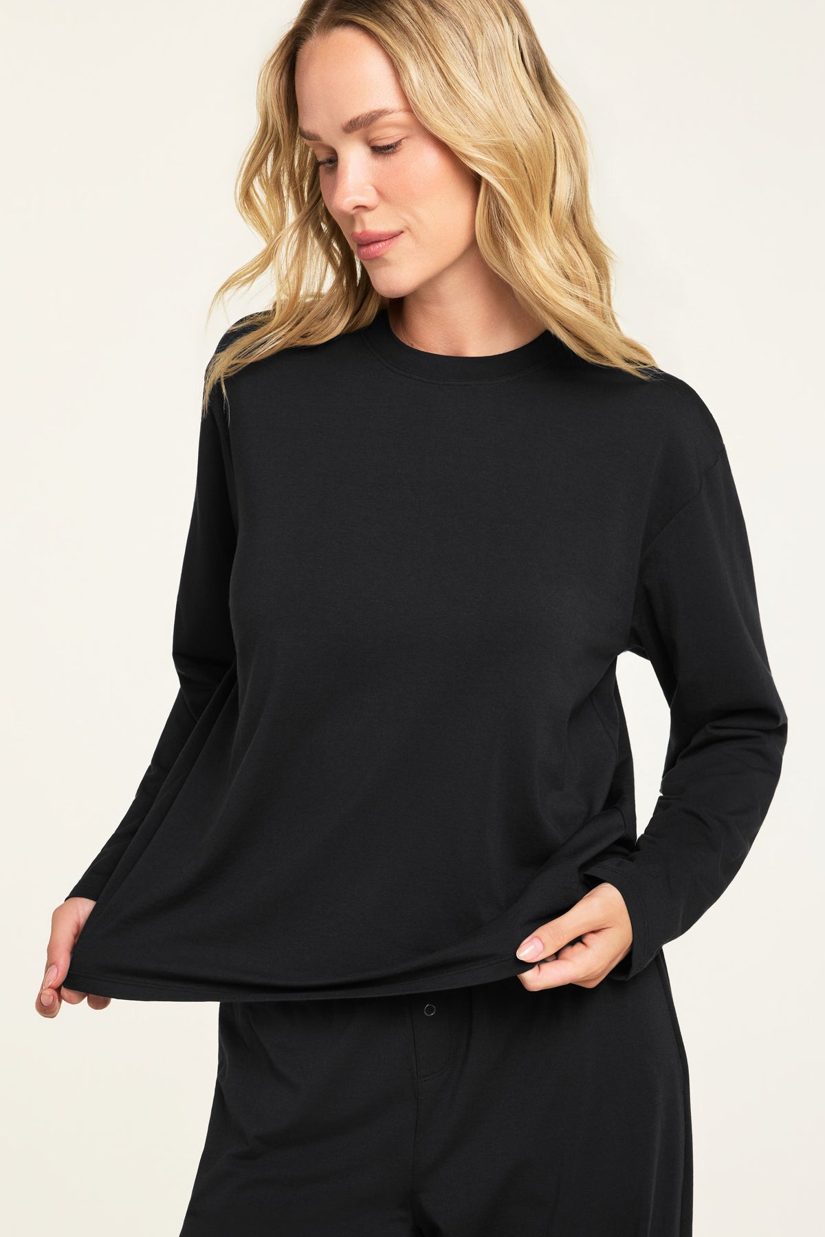 Close-up front view of the Cloud Cotton Long Sleeve T-Shirt in Black paired with the Cloud Cotton Pant in Black.