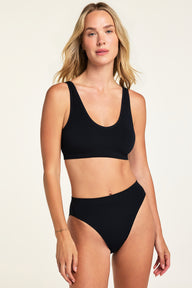 Close-up front view of the Knit Seamless Bralette in Black paired with the Knit Seamless French Cut Brief in Black.