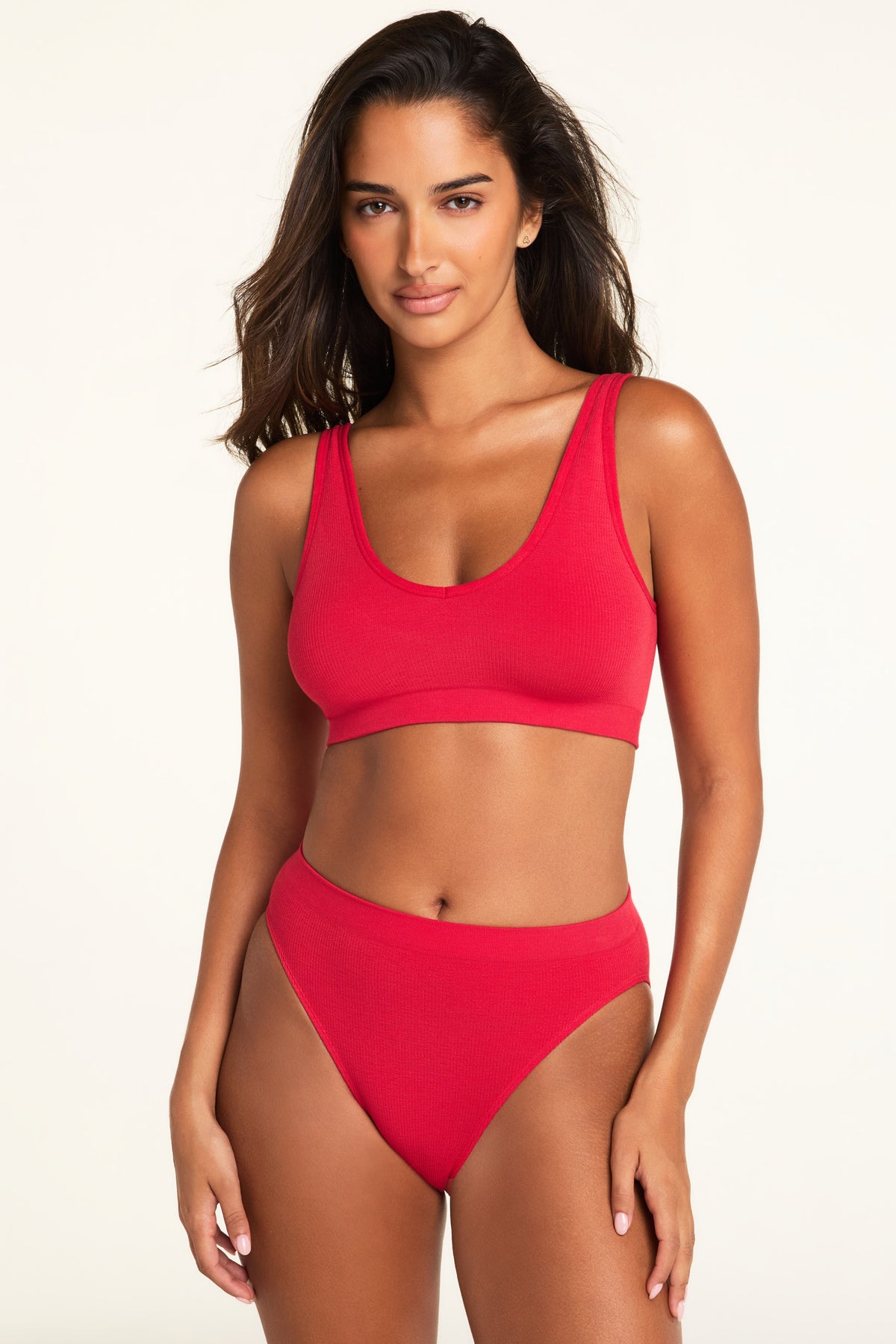 Close-up front view of the Knit Seamless Bralette in Cherry paired with the Knit Seamless French Cut Brief in Cherry.