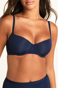 Side profile of the Base Balconette in Navy, showing the balconette cup shape and underwire silhouette
