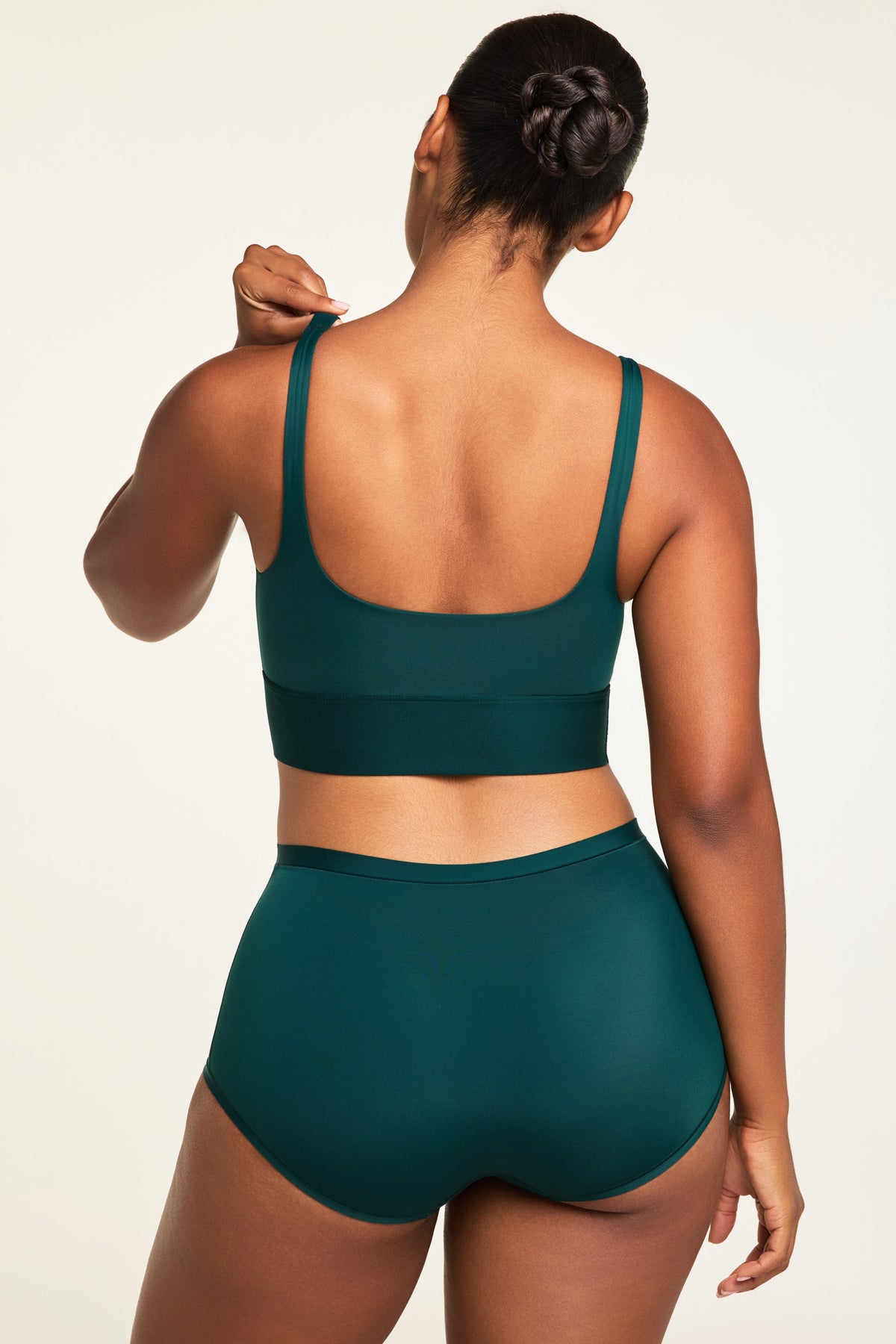 Side on-model view of the Bliss Boyshort in Pine paired with the Bliss Square Neck Bralette in Pine.