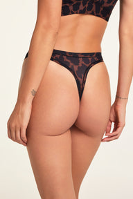 Side on-model view of the Bliss Thong in Leopard paired with the Bliss Triangle Bralette in Leopard.