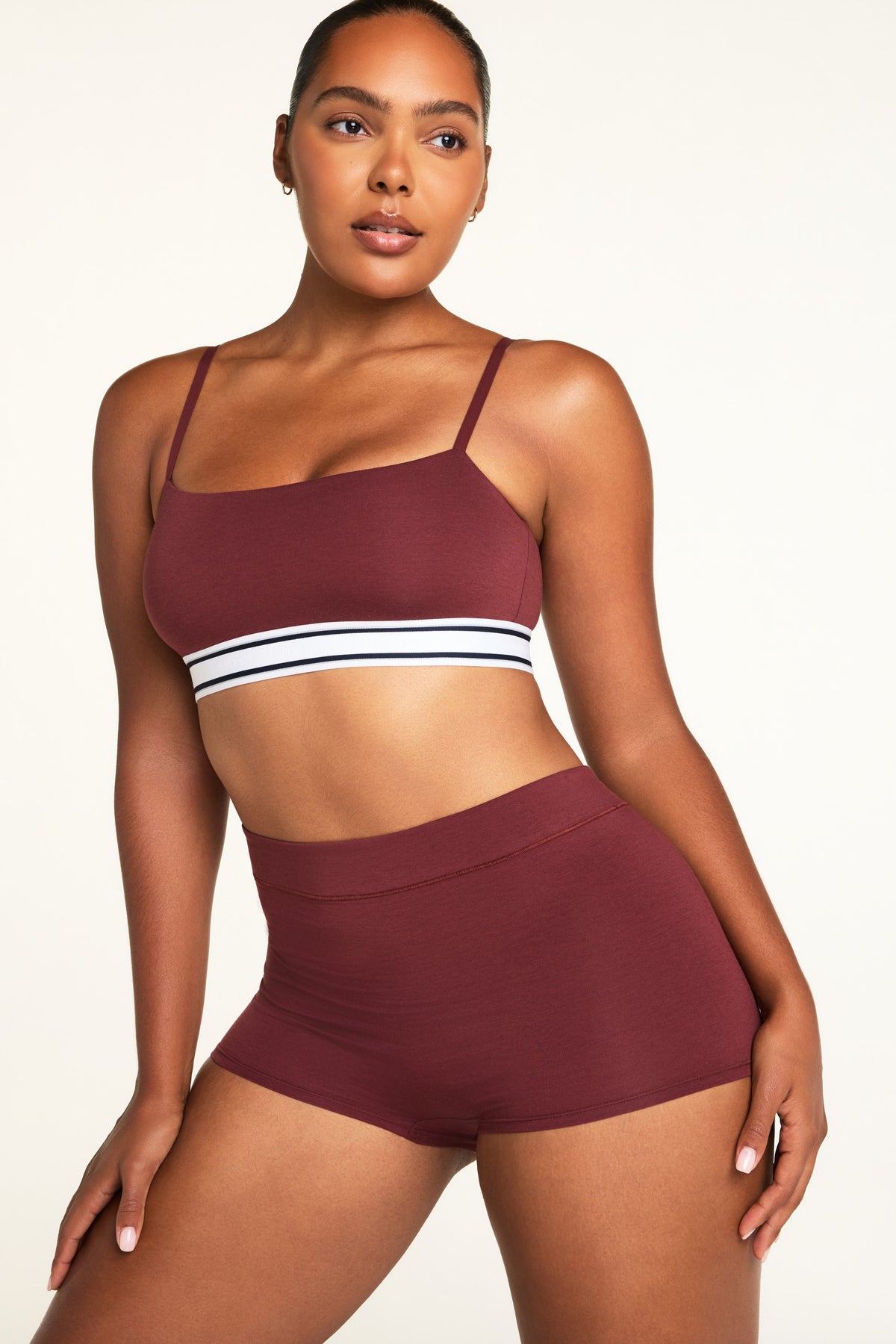 Side on-model view of the Cloud Cotton Highwaist Boyshort in Cabernet paired with the Cloud Cotton Bandeau Bralette in Cabernet.