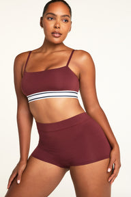 Side on-model view of the Cloud Cotton Highwaist Boyshort in Cabernet paired with the Cloud Cotton Bandeau Bralette in Cabernet.