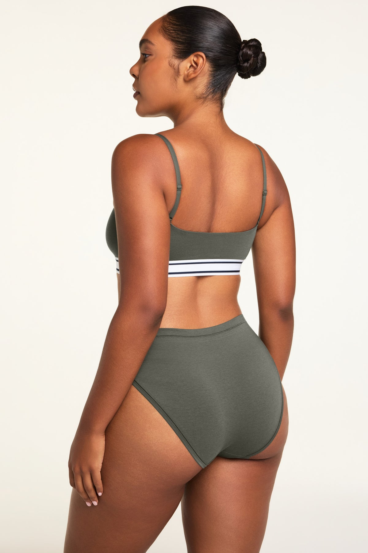 Side on-model view of the Cloud Cotton French Cut Brief in Olive paired with the Cloud Cotton Bandeau Bralette in Olive.