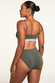 Side on-model view of the Cloud Cotton French Cut Brief in Olive paired with the Cloud Cotton Bandeau Bralette in Olive.