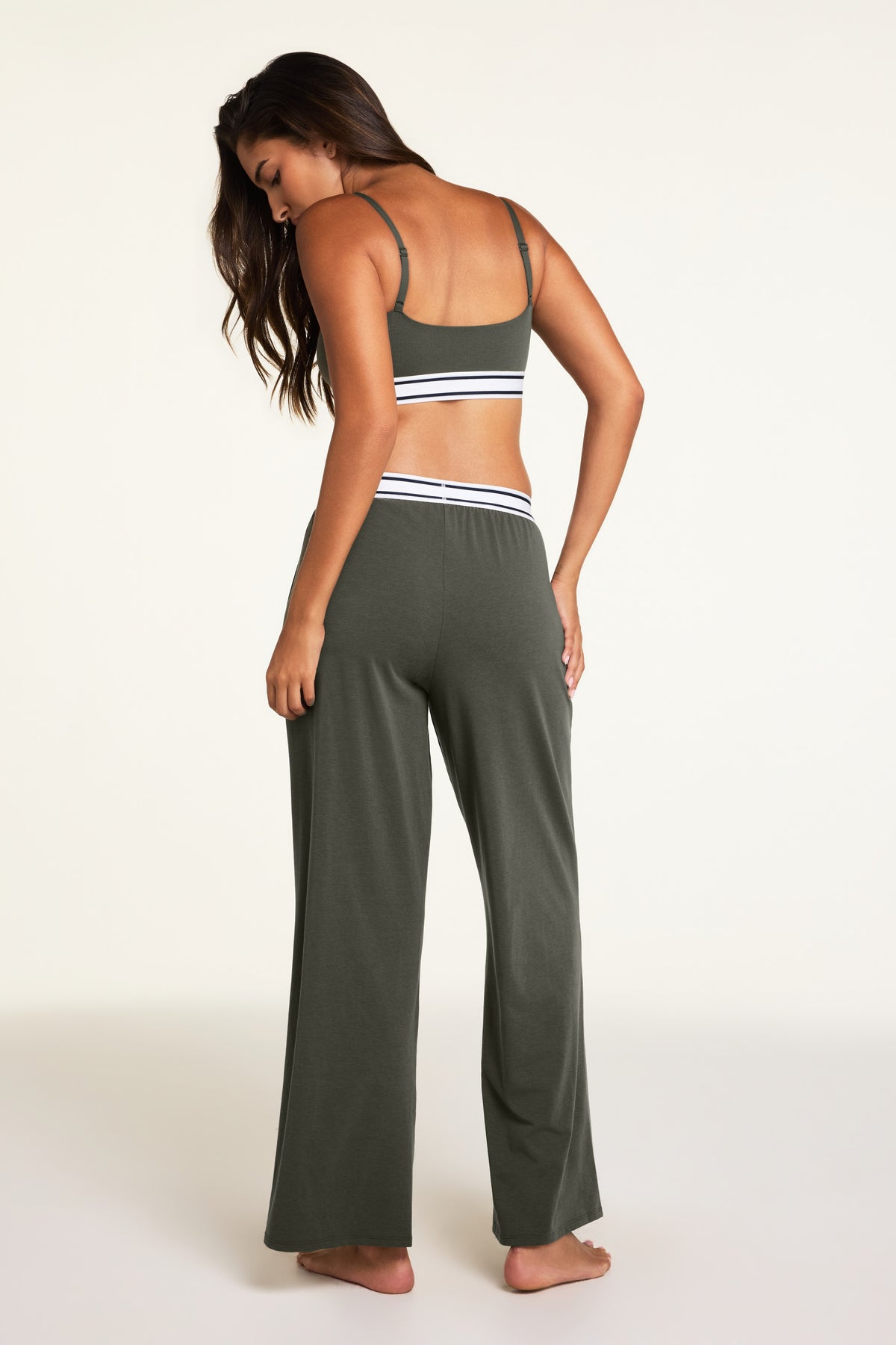 Side on-model view of the Cloud Cotton Pant in Olive paired with the Cloud Cotton Bandeau Bralette in Olive.