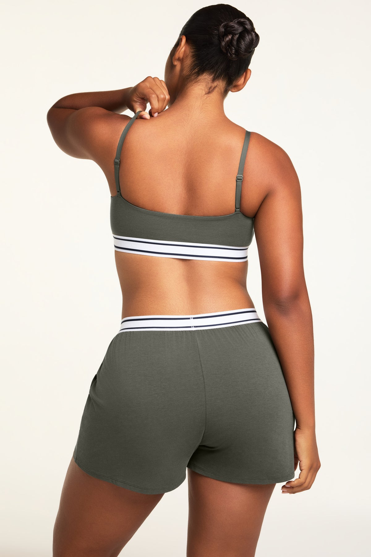 Side on-model view of the Cloud Cotton Short in Olive paired with the Cloud Cotton Bandeau Bralette in Olive.