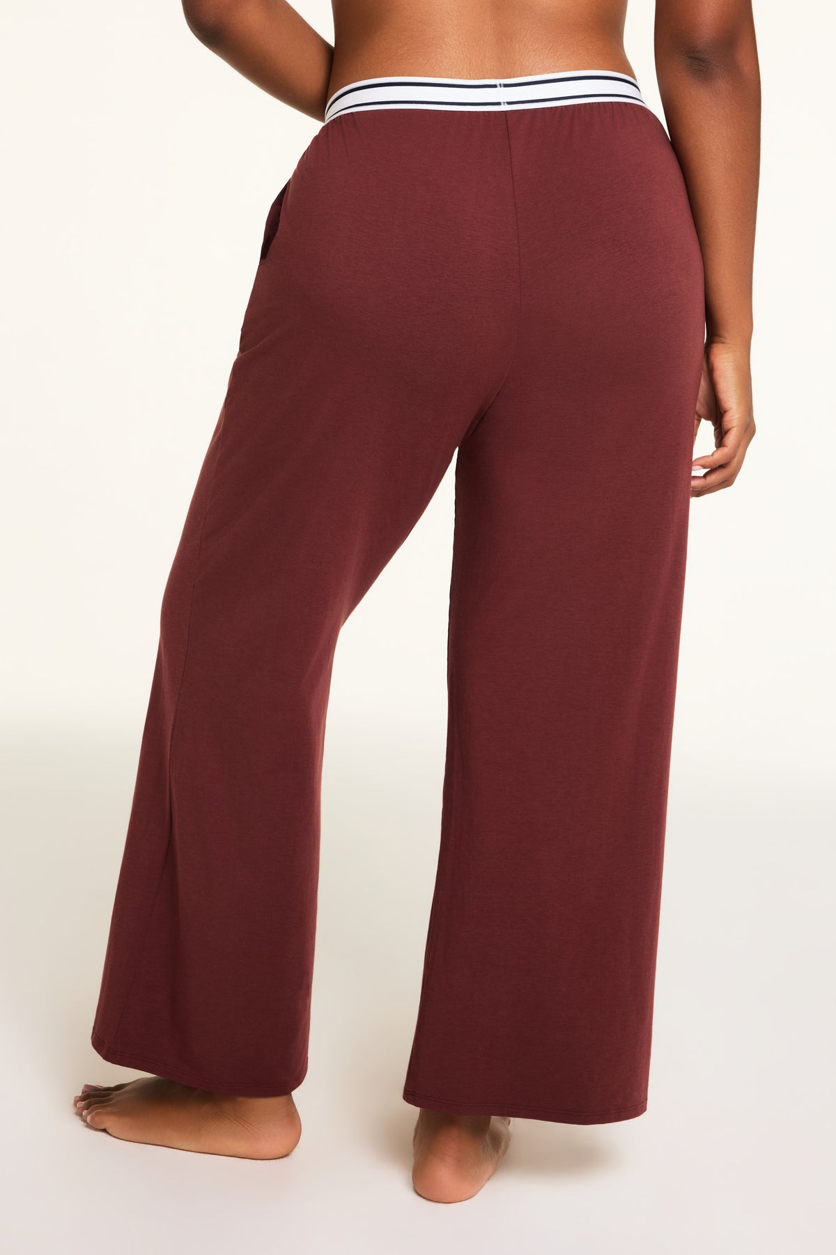 Side on-model view of the Cloud Cotton Pant in Cabernet paired with the Cloud Cotton Long Sleeve T-Shirt in Cabernet.