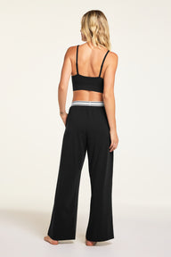 Side on-model view of the Cloud Cotton Pant in Black paired with the Cloud Cotton Long Sleeve T-Shirt in Black.