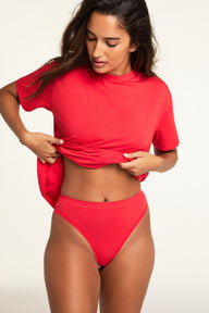 Side on-model view of the Cloud Cotton Highwaist Thong in Cherry paired with the Cloud Cotton T-Shirt in Cherry.