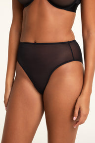 Side on-model view of the Cloud Cotton Short in Cherry paired with the ComfortMesh™ Plunge Bra in Black.