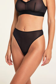 Side on-model view of the ComfortMesh™ Thong in Black paired with the ComfortMesh™ Triangle Bralette in Black.