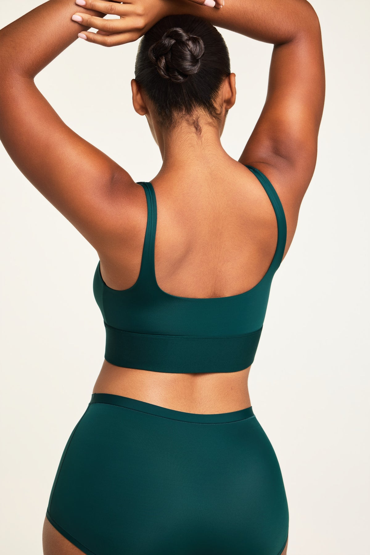 Side on-model view of the Bliss Square Neck Bralette in Pine paired with the Bliss Boyshort in Pine.