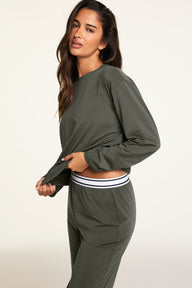 Side on-model view of the Cloud Cotton Long Sleeve T-Shirt in Olive paired with the Cloud Cotton Pant in Olive.