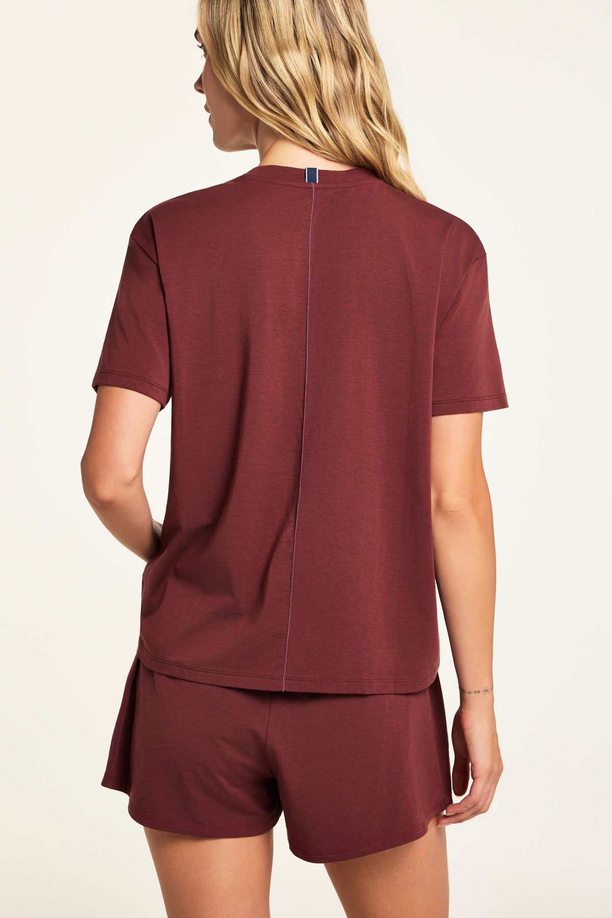 Side on-model view of the Cloud Cotton T-Shirt in Cabernet paired with the Cloud Cotton Short in Cabernet.