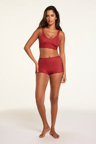 Three-quarter back view of the Bliss Boyshort in Ruby paired with the BlissSmooth Bralette in Ruby.