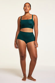 Three-quarter back view of the Bliss Boyshort in Pine paired with the Bliss Square Neck Bralette in Pine.