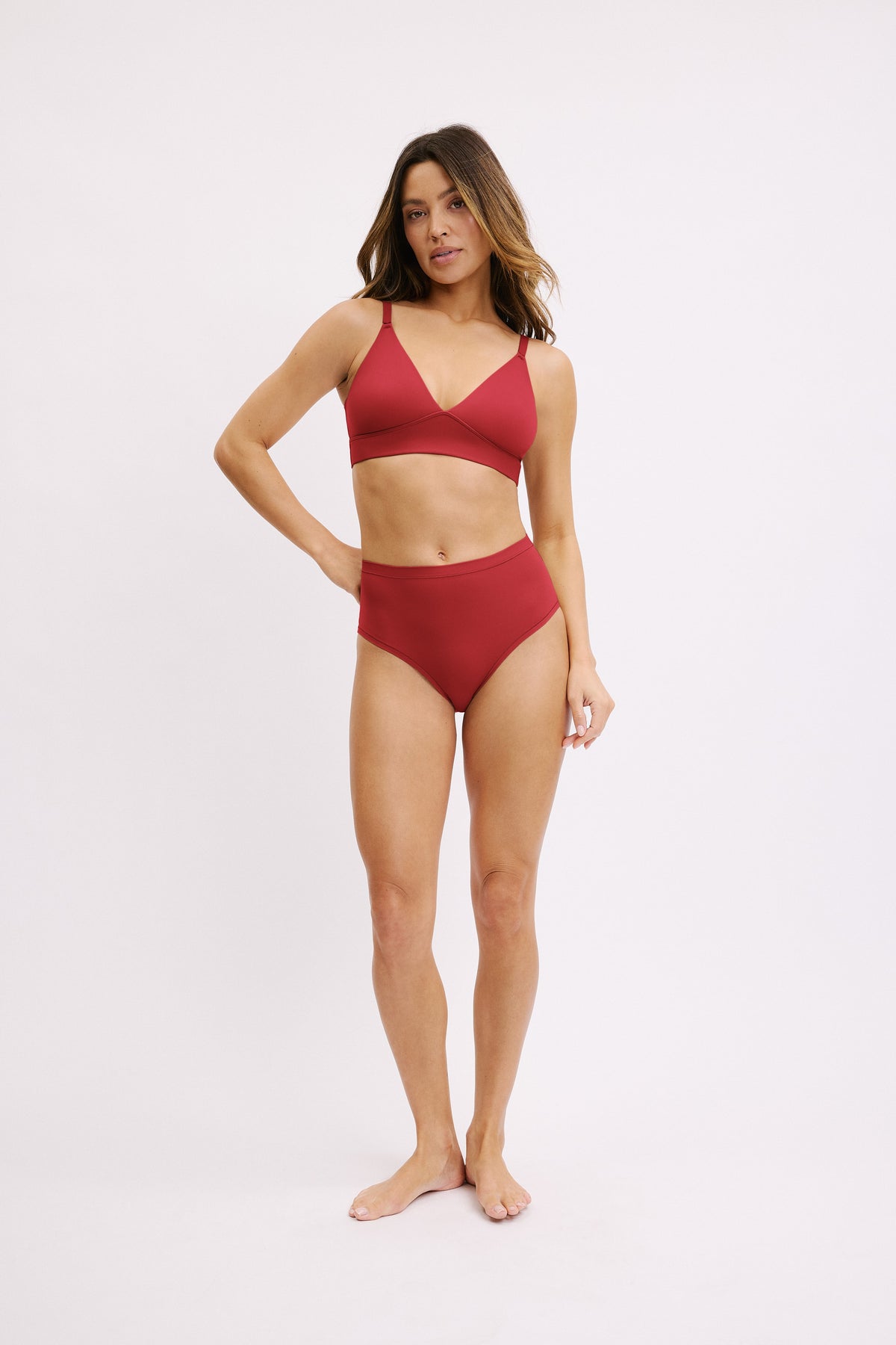Full-length front view of the Bliss Highwaist Brief in Ruby styled with the Bliss Triangle Bralette in Ruby.