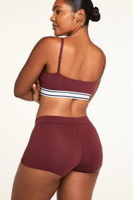 Three-quarter back view of the Cloud Cotton Highwaist Boyshort in Cabernet paired with the Cloud Cotton Bandeau Bralette in Cabernet.