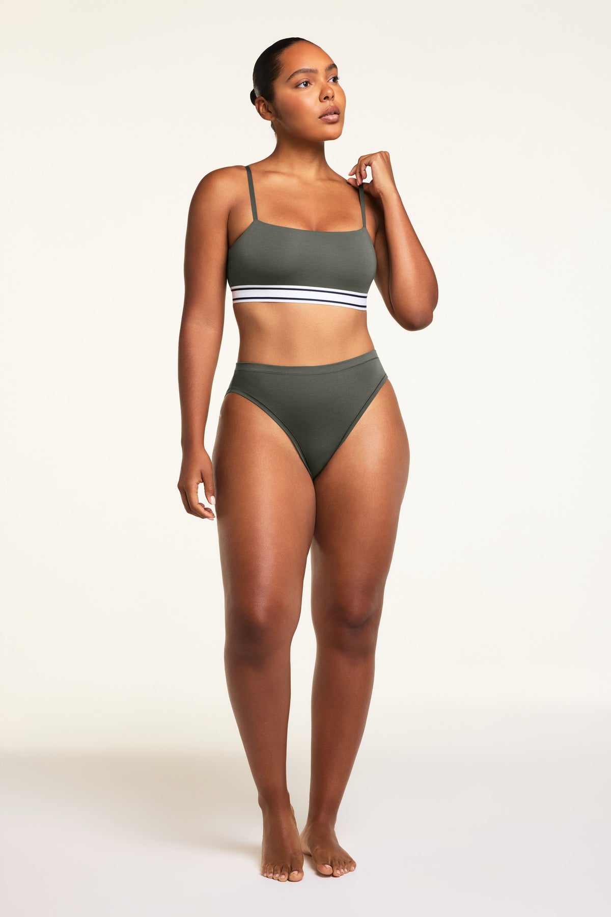 Three-quarter back view of the Cloud Cotton French Cut Brief in Olive paired with the Cloud Cotton Bandeau Bralette in Olive.
