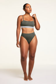 Three-quarter back view of the Cloud Cotton French Cut Brief in Olive paired with the Cloud Cotton Bandeau Bralette in Olive.
