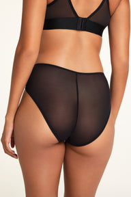 Three-quarter back view of the Cloud Cotton Short in Cherry paired with the ComfortMesh™ Plunge Bra in Black.