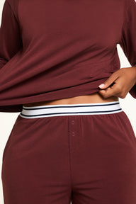 Three-quarter back view of the Cloud Cotton Long Sleeve T-Shirt in Cabernet paired with the Cloud Cotton Pant in Cabernet.
