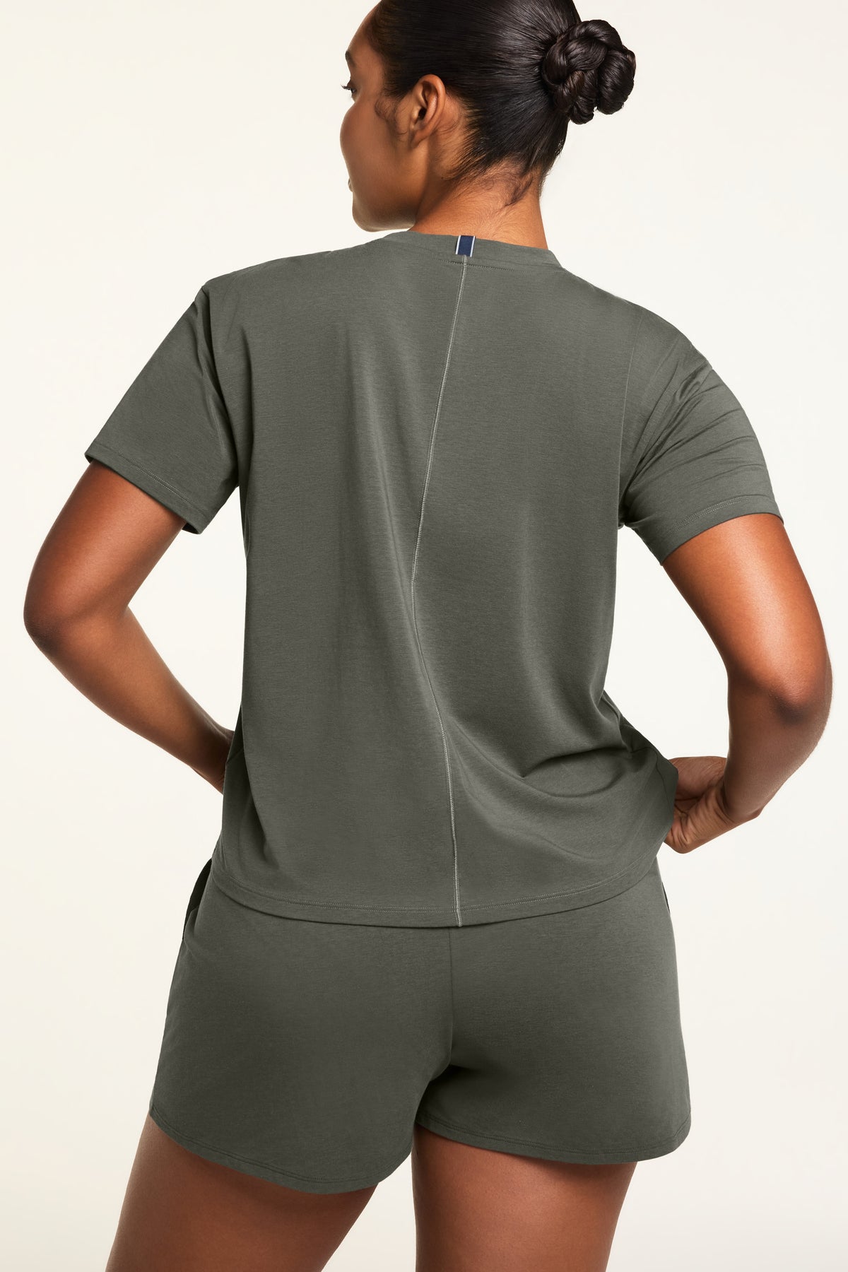 Three-quarter back view of the Cloud Cotton T-Shirt in Olive paired with the Cloud Cotton Short in Olive.