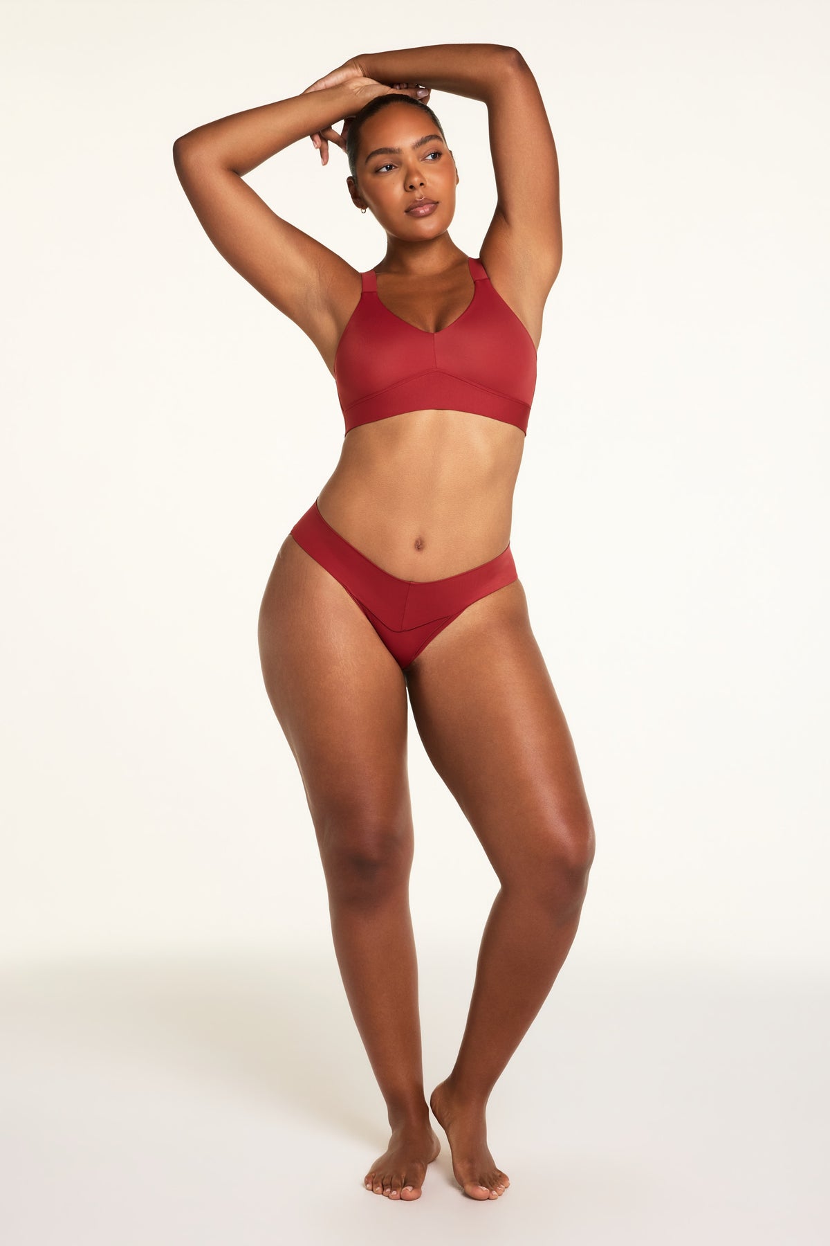 Back on-model view of the Bliss Low Rise Bikini in Ruby paired with the BlissSmooth Bralette in Ruby.