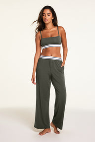 Back on-model view of the Cloud Cotton Pant in Olive paired with the Cloud Cotton Bandeau Bralette in Olive.