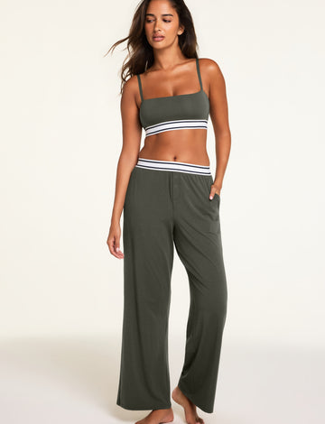 Back on-model view of the Cloud Cotton Pant in Olive paired with the Cloud Cotton Bandeau Bralette in Olive.