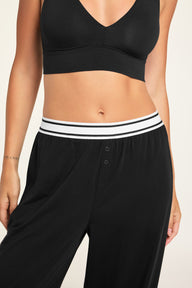 Back on-model view of the Cloud Cotton Pant in Black paired with the Cloud Cotton Long Sleeve T-Shirt in Black.