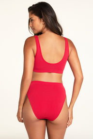 Back on-model view of the Knit Seamless French Cut Brief in Cherry paired with the Knit Seamless Bralette in Cherry.