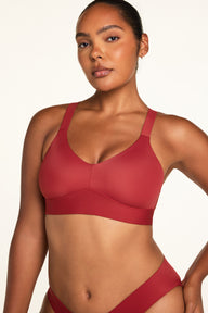 Back on-model view of the BlissSmooth Bralette in Ruby paired with the Bliss Low Rise Bikini in Ruby.