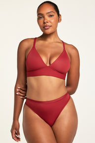 Back on-model view of the Bliss Triangle Bralette in Ruby paired with the Bliss Thong in Ruby.
