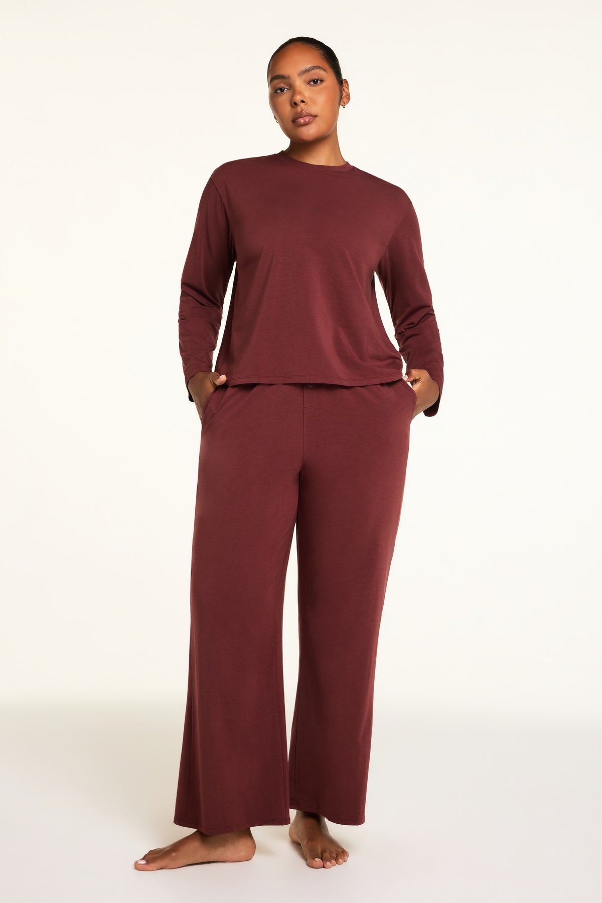Back on-model view of the Cloud Cotton Long Sleeve T-Shirt in Cabernet paired with the Cloud Cotton Pant in Cabernet.