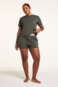 Back on-model view of the Cloud Cotton T-Shirt in Olive paired with the Cloud Cotton Short in Olive.