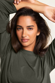 On-model product shot of the Cloud Cotton Long Sleeve T-Shirt in Olive paired with the Cloud Cotton Pant in Olive.