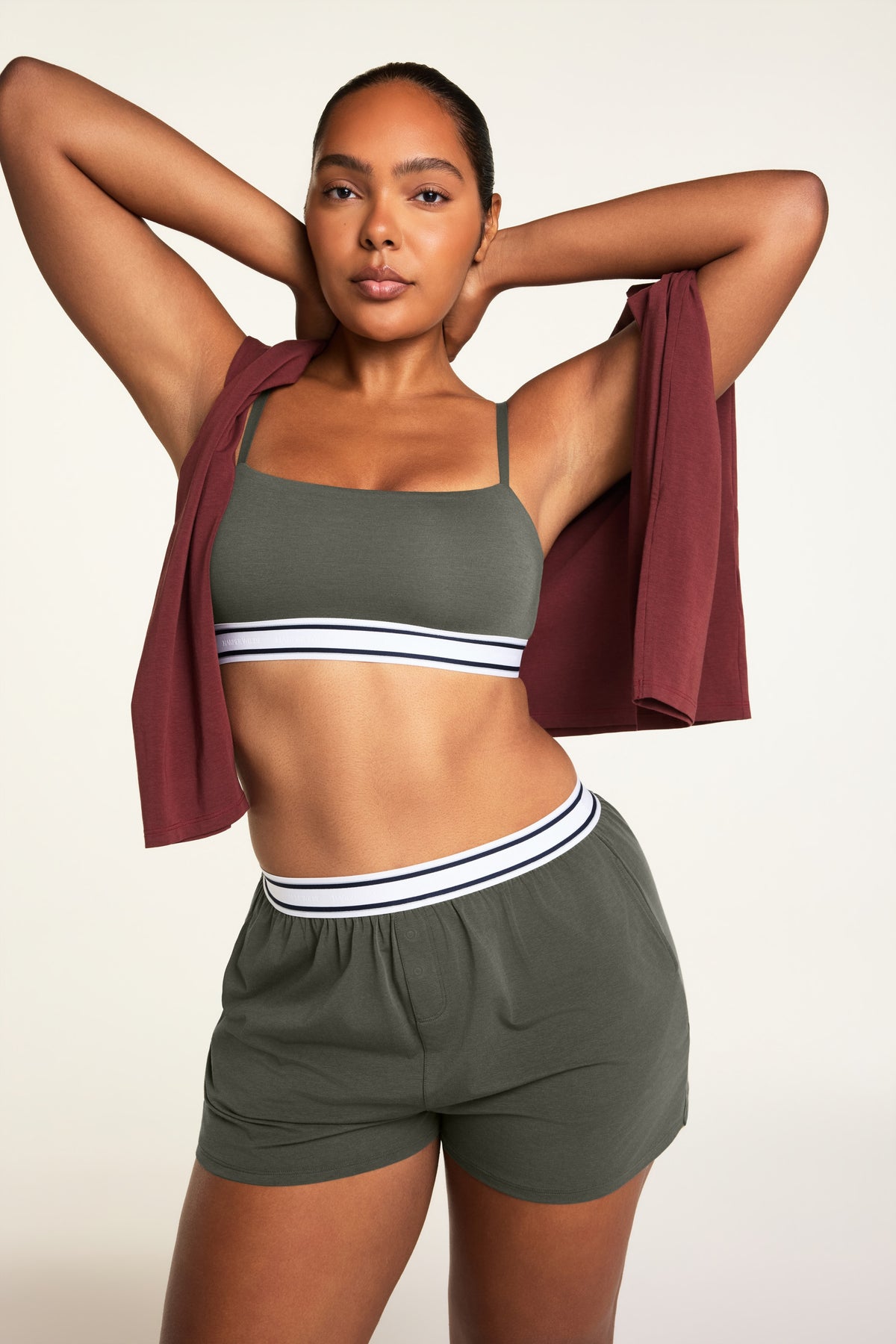 Editorial on-model shot of the Cloud Cotton Bandeau Bralette in Olive styled with the Cloud Cotton Short in Olive.