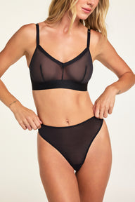 Close-up detail of the ComfortMesh™ Thong in Black paired with the ComfortMesh™ Triangle Bralette in Black.