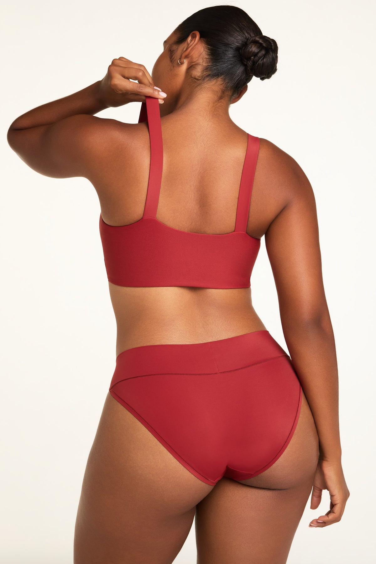 Close-up detail of the BlissSmooth Bralette in Ruby paired with the Bliss Low Rise Bikini in Ruby.