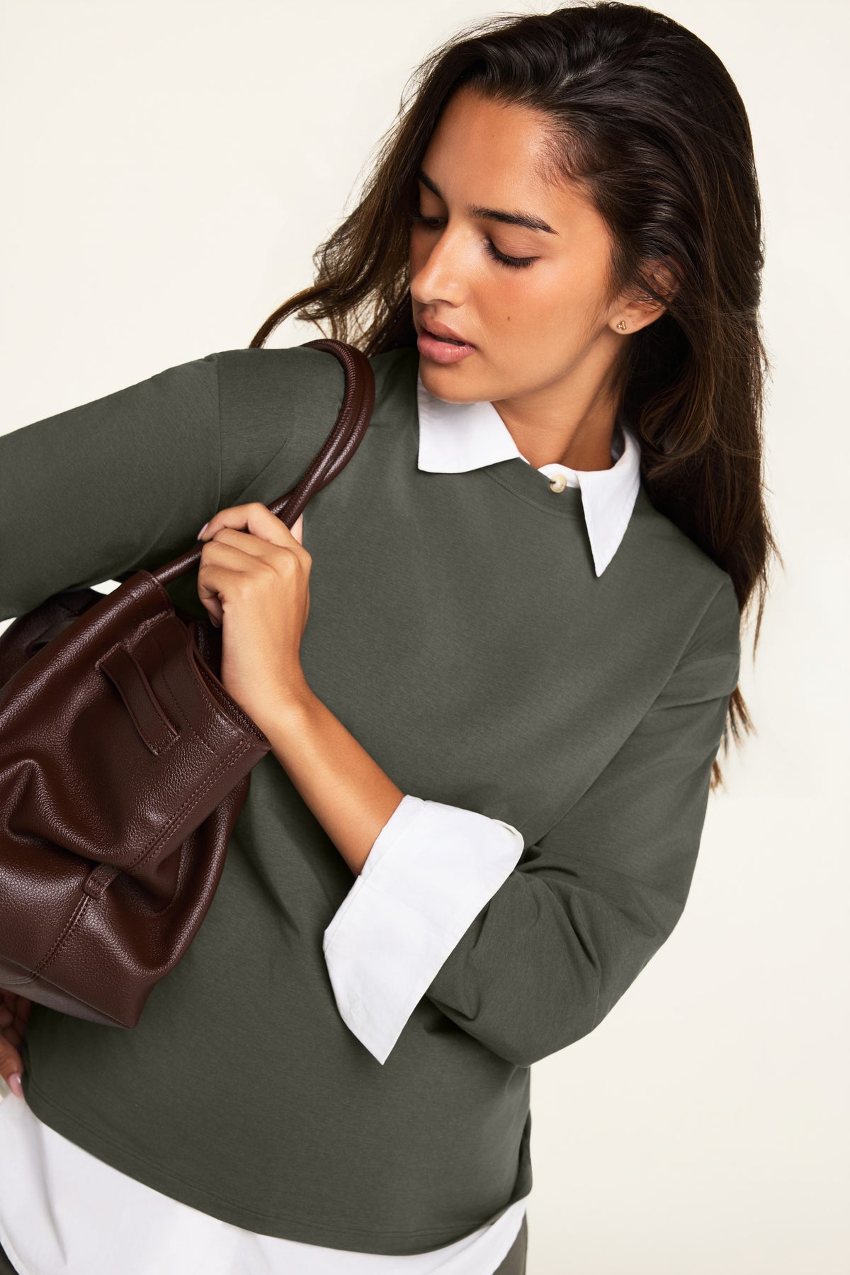 On-model product shot of the Cloud Cotton Long Sleeve T-Shirt in Olive paired with the Cloud Cotton Pant in Olive.