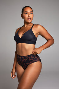 Editorial on-model shot of the Bliss Triangle Bralette in Black styled with the Bliss Highwaist Brief in Leopard.