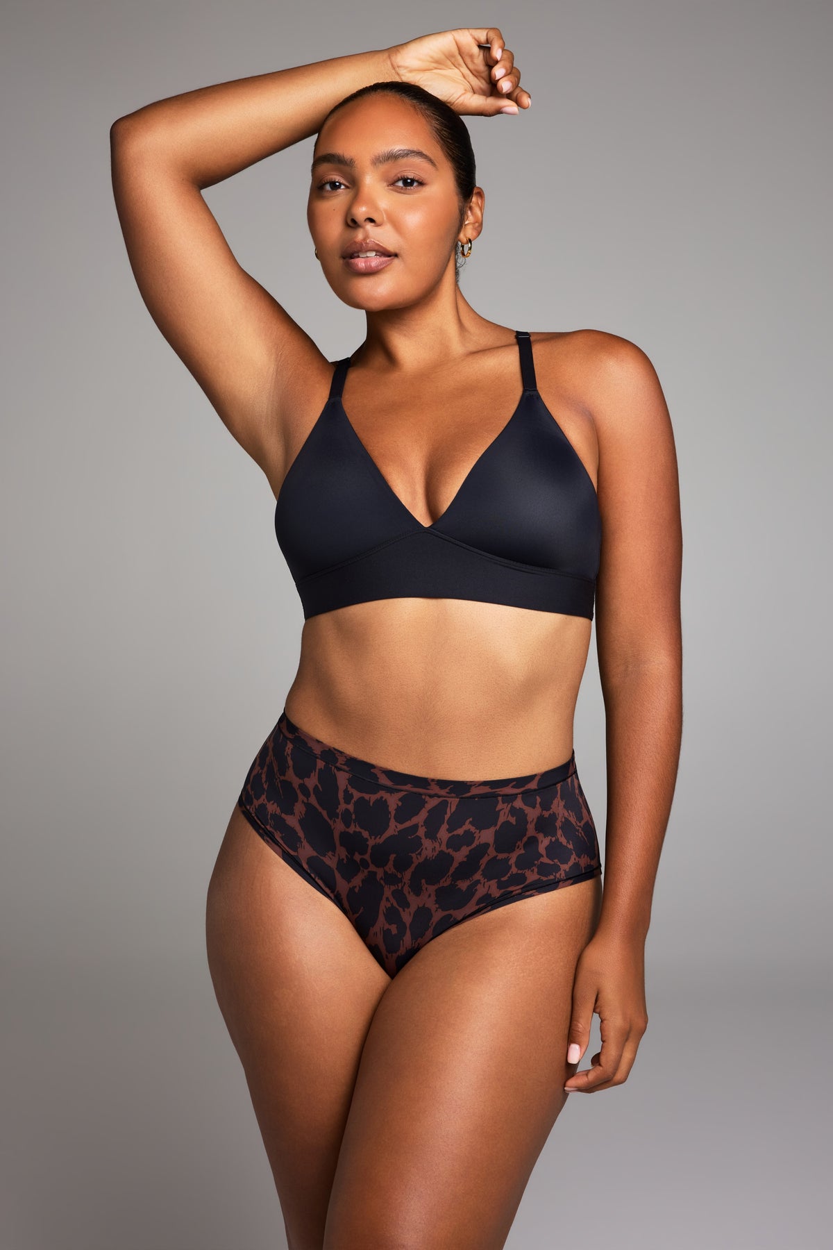 Editorial on-model shot of the Bliss Triangle Bralette in Black styled with the Bliss Highwaist Brief in Leopard.