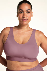 Front view of the Bliss Scoop Adjustable Bralette in Mirage on a model, showing the wide scoop neckline and smooth wireless coverage. sizing: Jennifer wears size XL