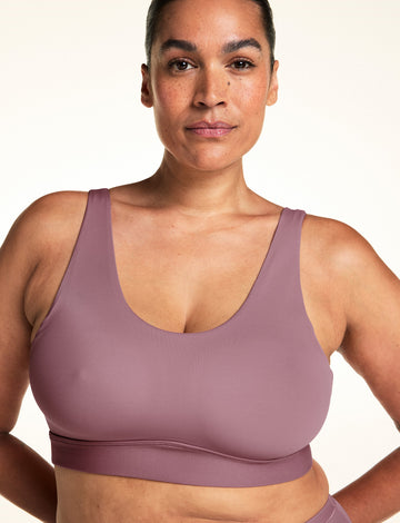 Front view of the Bliss Scoop Adjustable Bralette in Mirage on a model, showing the wide scoop neckline and smooth wireless coverage. sizing: Jennifer wears size XL