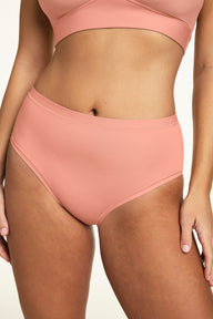 In a close-up studio image, Sonnie wears the Bliss Brief in Cabana with the Bliss bralette, highlighting the smooth fabric, high-rise silhouette, and soft waistband.  sizing: Sonnie wears size Large