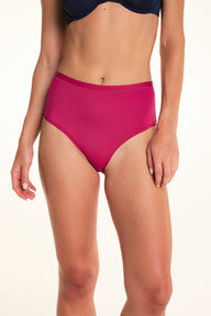 On a light studio backdrop, Alexis wears the Bliss Highwaist underwear in Winterberry. The front view highlights the high-rise silhouette, smooth fabric, and full-coverage design. sizing: Alexis wears size Small